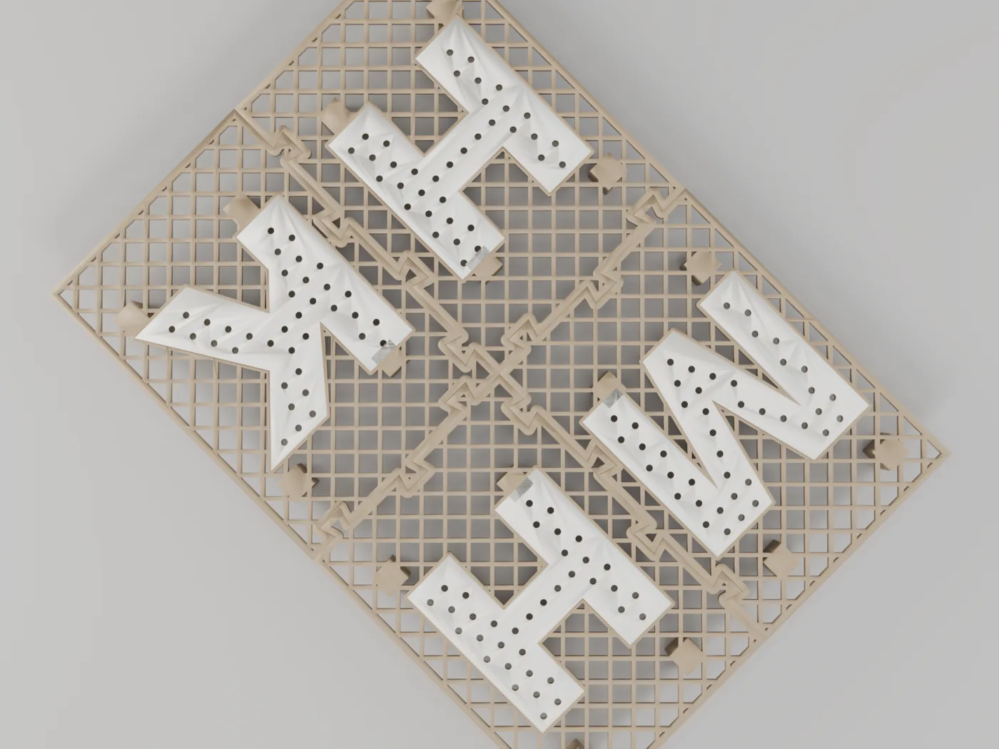 Top-down render of the assembled four-piece mailbox stand-off grate — a warm-beige 45-degree cross-hatch drainage mesh with four two-color cream letters (M, H, H, K) peppered with drain holes, arranged around the diagonal dovetail seams